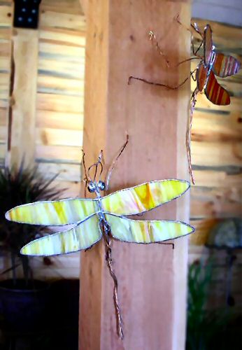 yellow and orange glass dragonflies